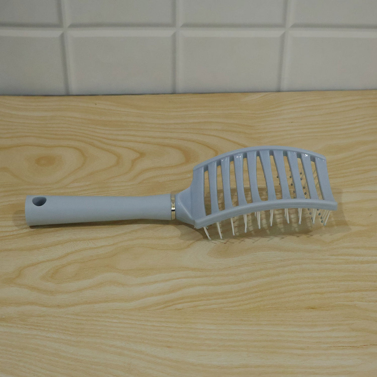 Curved hair brush styling use