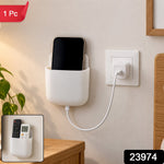 White adhesive organizer with a phone charging, and a small inset showing it holding two remote controls.