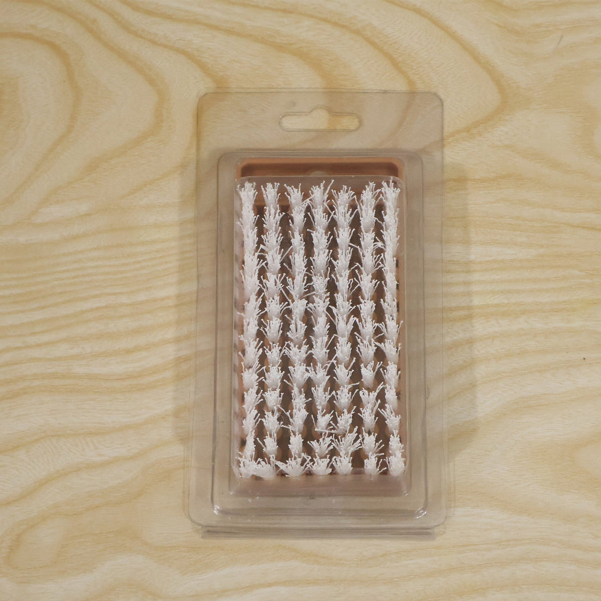 Live photo of cleaning brush in card packing