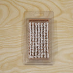 Live photo of cleaning brush in card packing