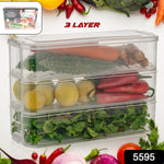Stackable fridge storage containers holding fresh vegetables and fruits inside a refrigerator.