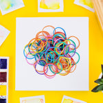 Vibrant multicolor rubber bands bundled together for office organization.