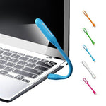 A blue flexible USB LED lamp plugged into a laptop, with five other colored lamps shown vertically on the right.