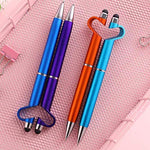 Four 3-in-1 stylus pens in blue, purple, orange, and light blue, with heart-shaped phone stands.