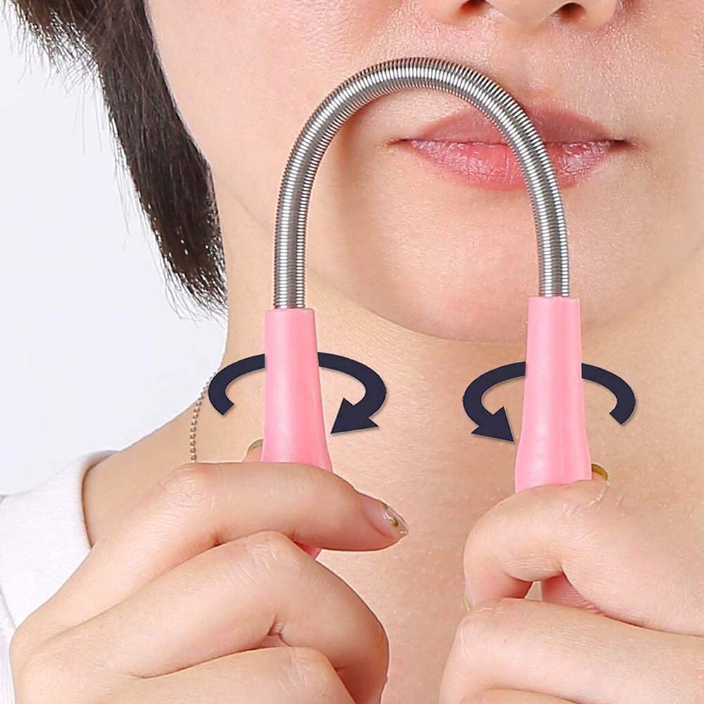 A person's chin and mouth with the pink and silver facial hair remover spring tool in use, showing rotating arrows.
