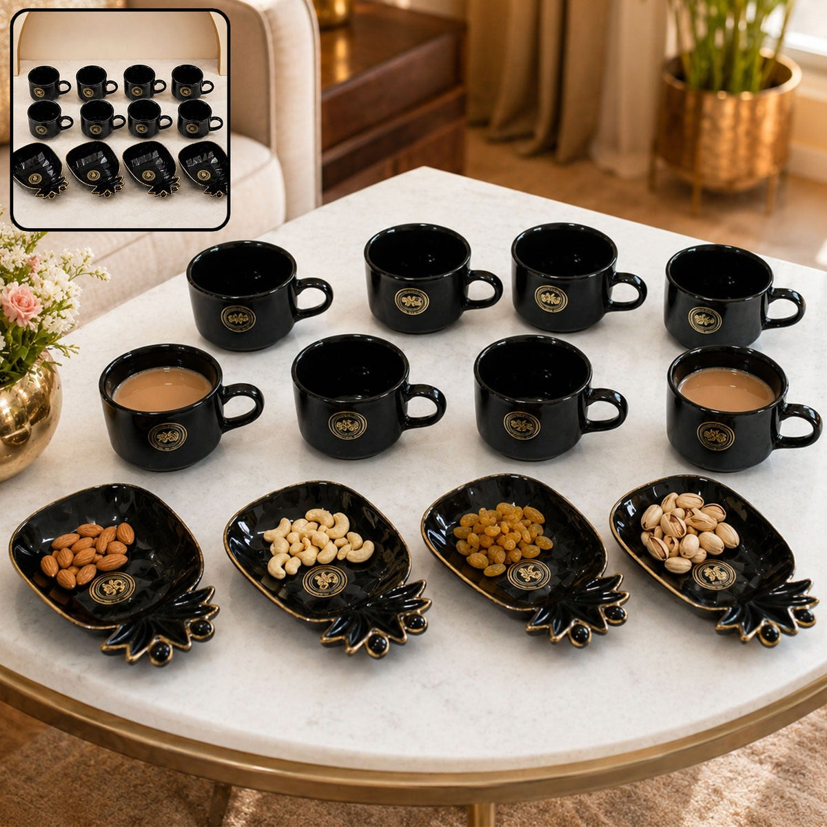 A black ceramic tea set with eight cups and four pineapple-shaped snack bowls, filled with nuts, on a white table.