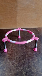 Single ring matka stand made of high-quality stainless steel on a wooden surface.