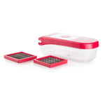 Ganesh vegetable chopper with various blade types laid out, showcasing its versatility.