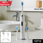 Electric toothbrush with ergonomic handle and soft bristle brush head attached