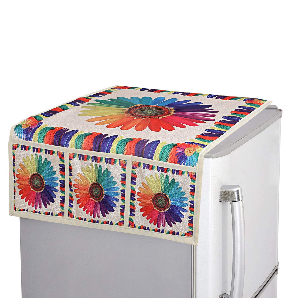 A refrigerator top cover with a large rainbow sunflower design and matching pocket details on a silver fridge.