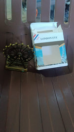 Compact metal desktop wheel tower ornament for office or home