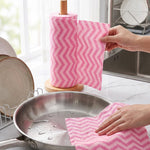 Cloth sheet wiping a kitchen countertop