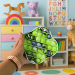 Silicone pop it fidget toy viewed from angle showing bubble layout