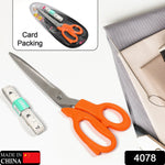 Close-up of ergonomic handles on tailor scissors, designed for comfortable grip during sewing.