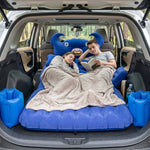 Vehicle interior with inflated inflatable car mattress and cushions