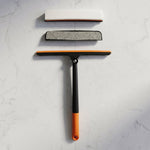 Versatile squeegee for cleaning car windshields, windows, and bathroom tiles