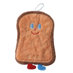 A brown microfiber cartoon bread slice towel with blue eyes, red smile, and two small feet.
