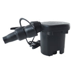 The black electric air pump with its attached cord and nozzle rests on a light surface with camping gear nearby.