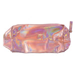 A woman's hands reach into the open holographic pink makeup bag on a bathroom counter with other cosmetics.