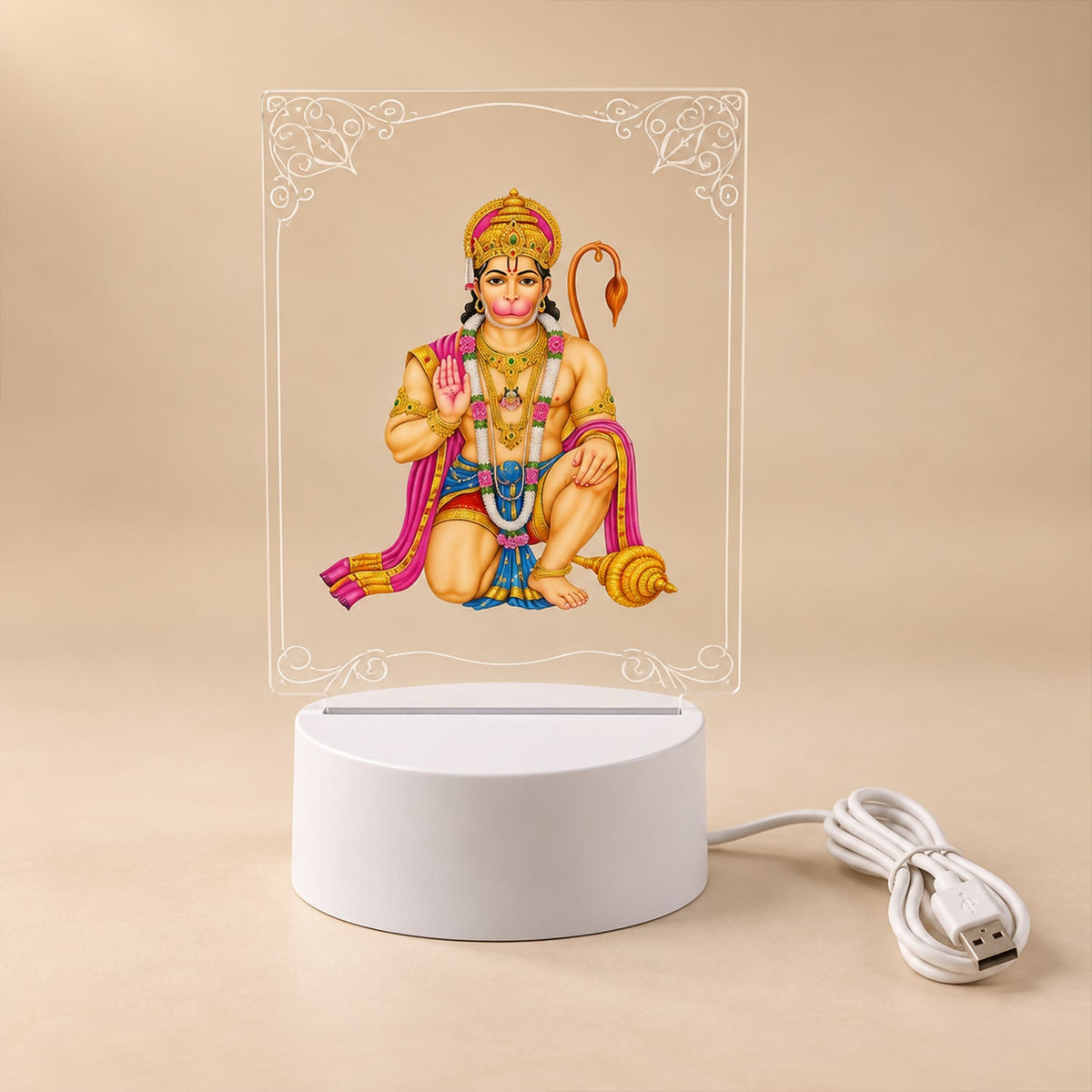 A Hanuman LED acrylic night lamp with its white base and USB cable, presented on a light neutral background.