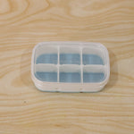 Compact home ice tray in use, perfect for small freezers and daily needs.