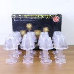 Live image of crystal style LED table lamp emitting warm light