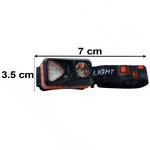The orange and black headlamp with its strap and dimensions of 7 cm length and 3.5 cm height indicated.