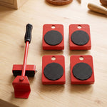 A complete set of red furniture lifter and four wheeled sliders with black anti-slip pads on a light wooden surface.