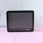 Side view of reusable savings tracker money box with goal chart