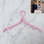 Foldable travel hanger showing compact folded design for easy packing