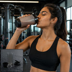 A woman in a black sports bra drinks from a grey and black shaker bottle in a gym, with an inset of the disassembled bottle