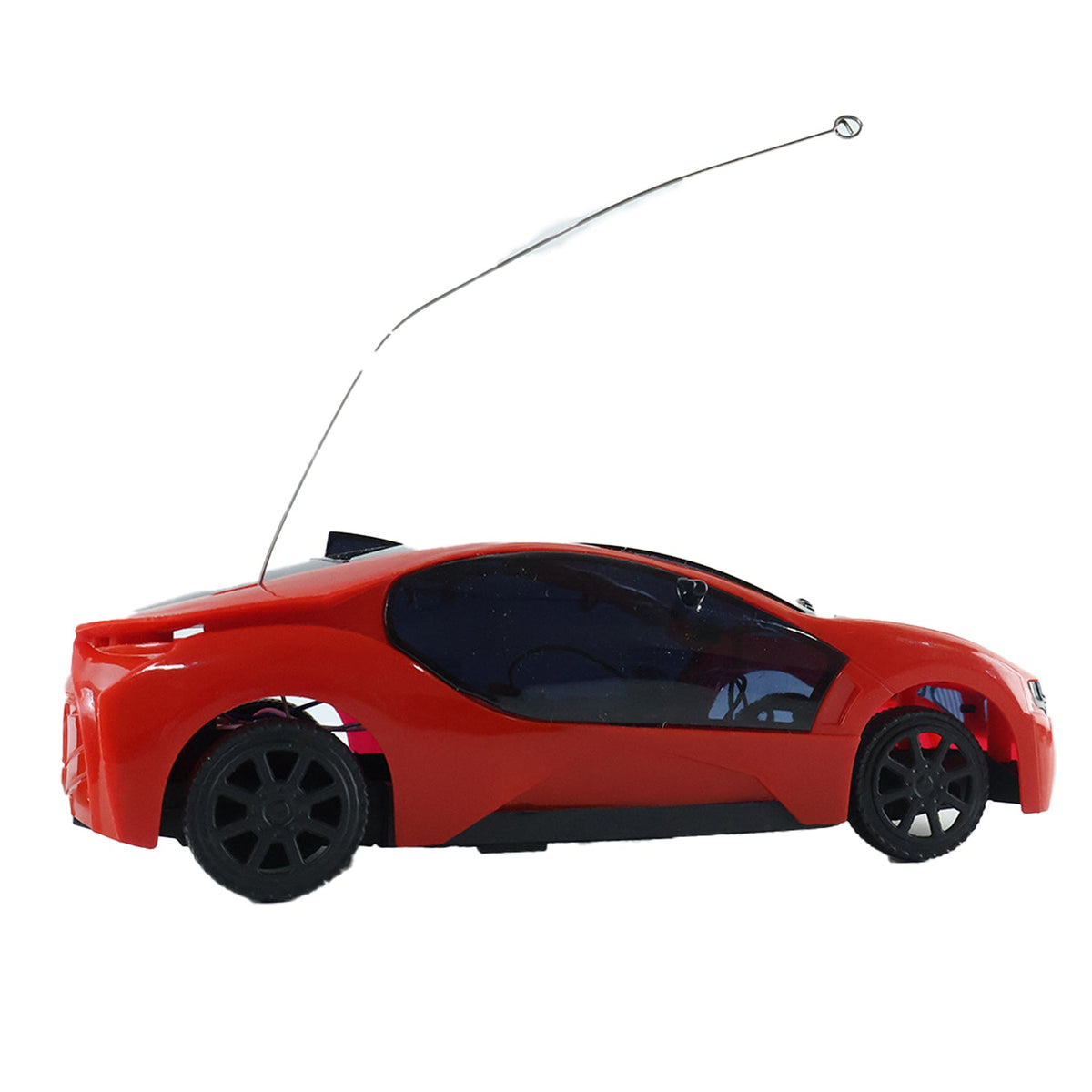 A red remote control car with black wheels and a long antenna is viewed from the side on a white background.