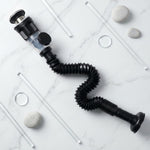 Close-up shot of flexible sink drain pipe being installed in bathroom