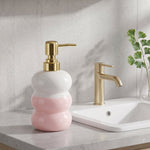 Countertop soap pump bottle in glass with gold accent
