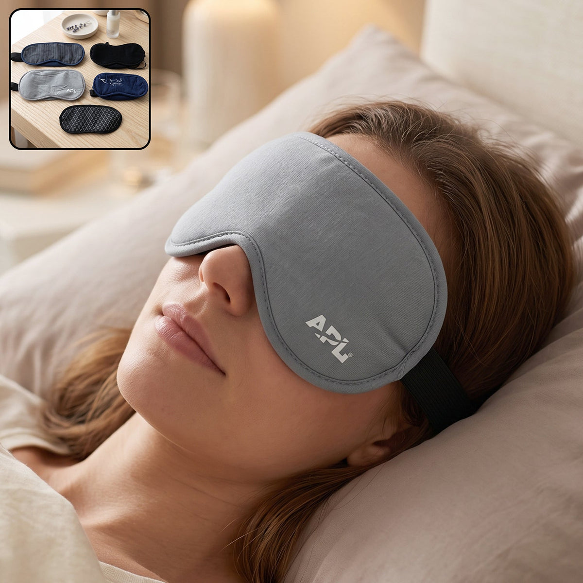 A woman sleeps peacefully wearing a light grey eye mask with APL logo, with a small inset showing five different mask