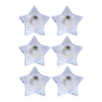 Battery operated LED candles in star-shaped holders for safe lighting