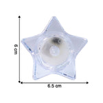 Warm flickering glow from star-shaped flameless LED candles