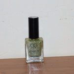 Starlet glitter nail paint shimmering on nails in Sunshine Gold shade