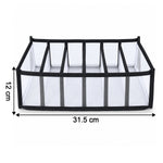 A white mesh and black fabric 6-section drawer organizer with dimensions 31.5 cm length and 12 cm height.