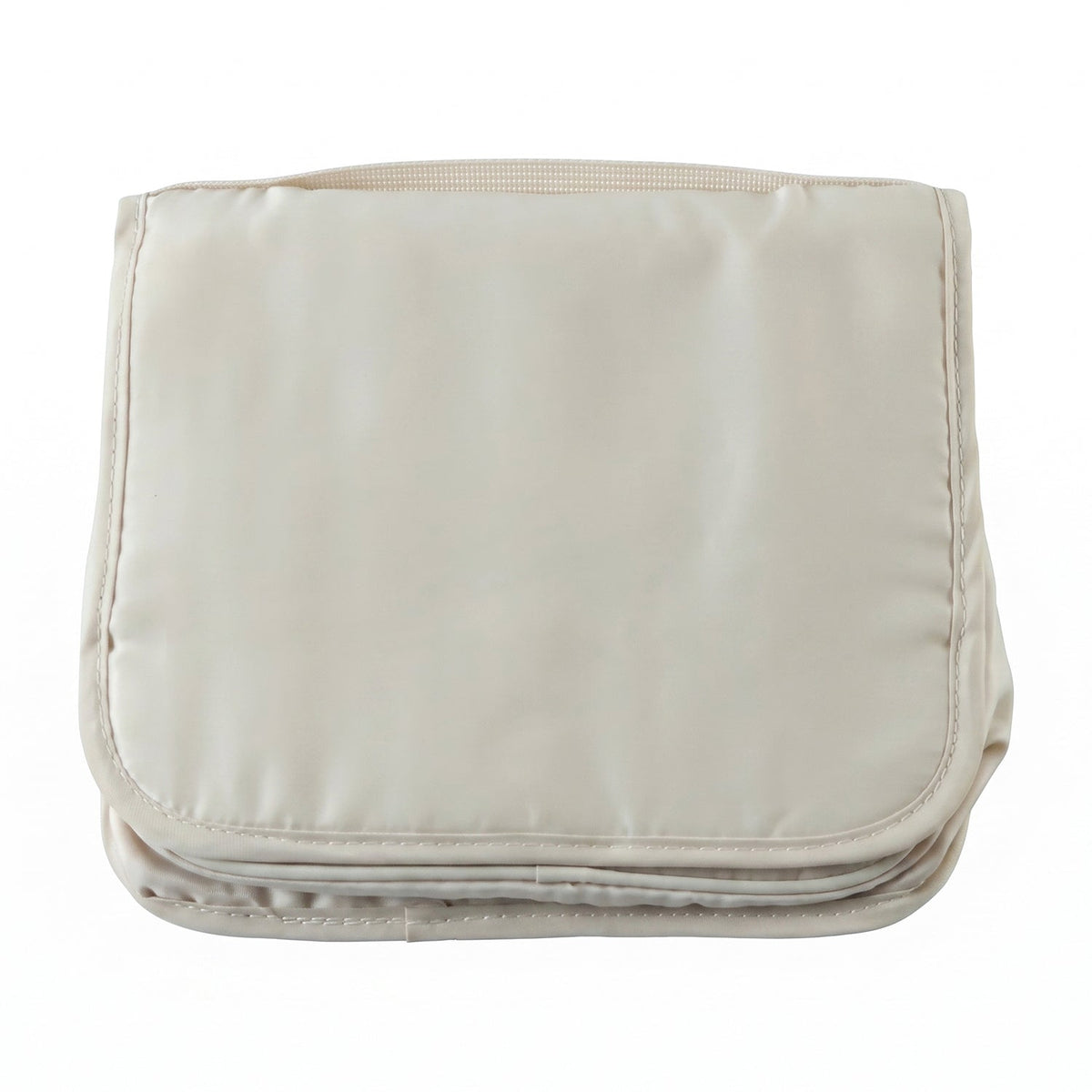 A neatly folded rectangular beige toiletry bag with a handle on a plain white background.