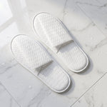 White disposable slippers with cushioned soles