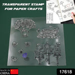 A clear rubber stamp sheet with designs of a tree, bird's nest, and birdhouses is displayed on a green background.