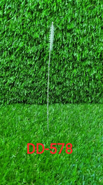The 23cm long straw brush demonstrating flexible cleaning.