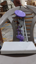 Detailed view of the top hanging ring and bamboo structure of the wind chime.