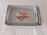 Close-up view of the ergonomic handle on a plastic storage tray