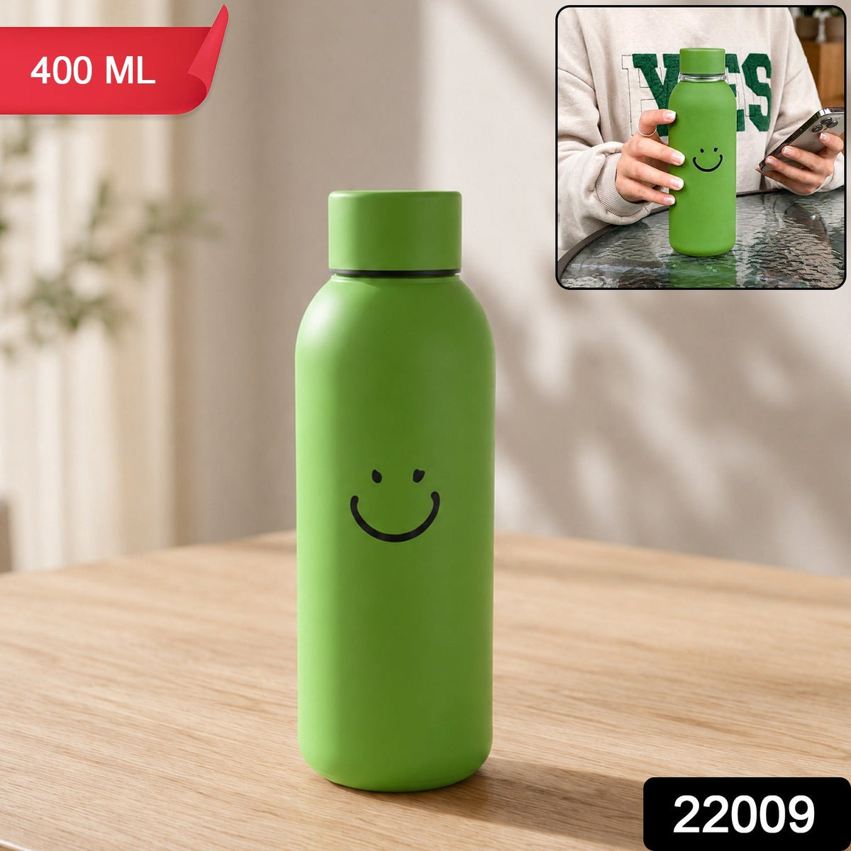 Green glass water bottle with a smiley face on a wooden table, with an inset showing a person holding a similar bottle. The