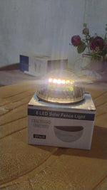 Solar LED wall mount fence light attached on outdoor wall