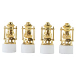 Three vintage lantern-style flameless LED tealights glowing in a dark setting.