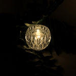 Close-up of crystal style LED decorative lamp showing diamond-cut design