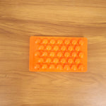 Kitchen candy making mold in orange
